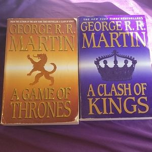2 large print Game of Throne books.